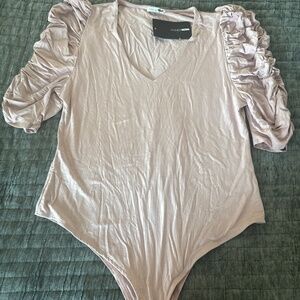 Rose colored body suit